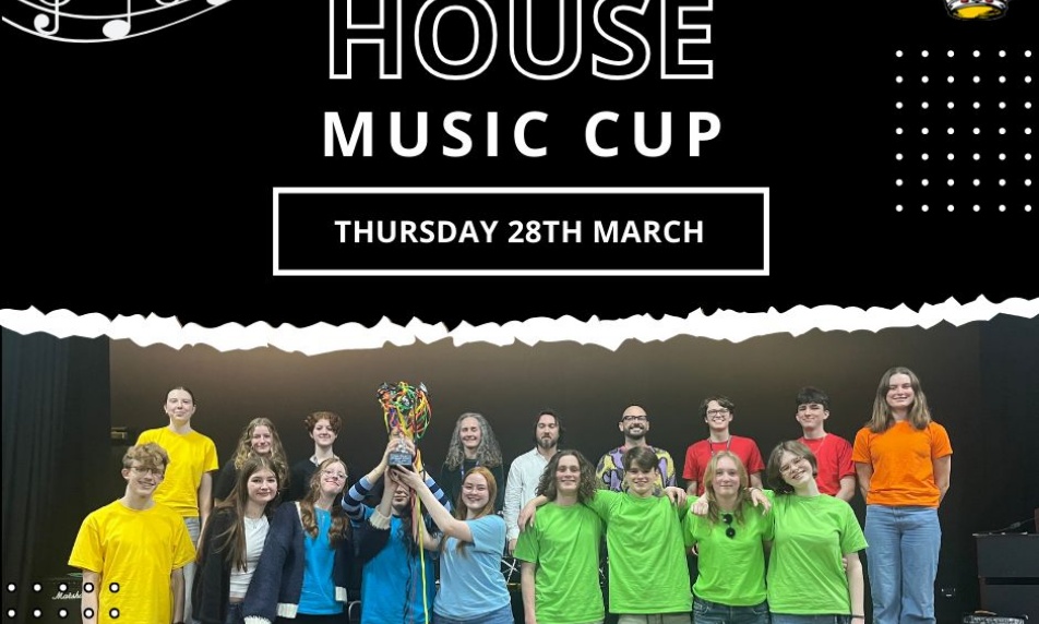 Image of event participants with the winning students holding the cup aloft